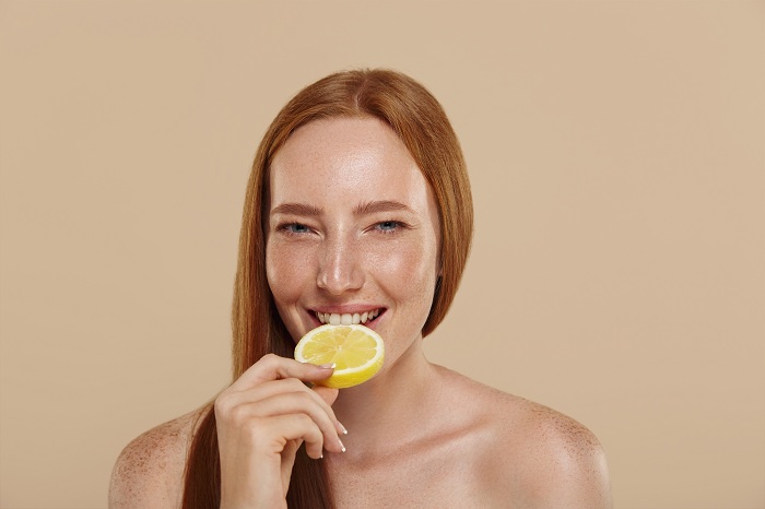 Ginger girl with a slice of lemon