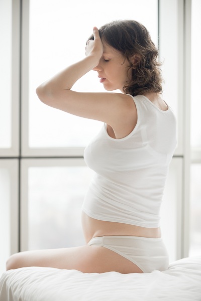 Pregnant woman having body discomfort