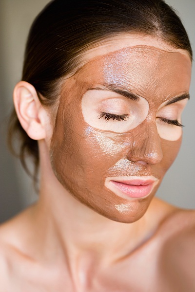 Woman with face mask on for skincare