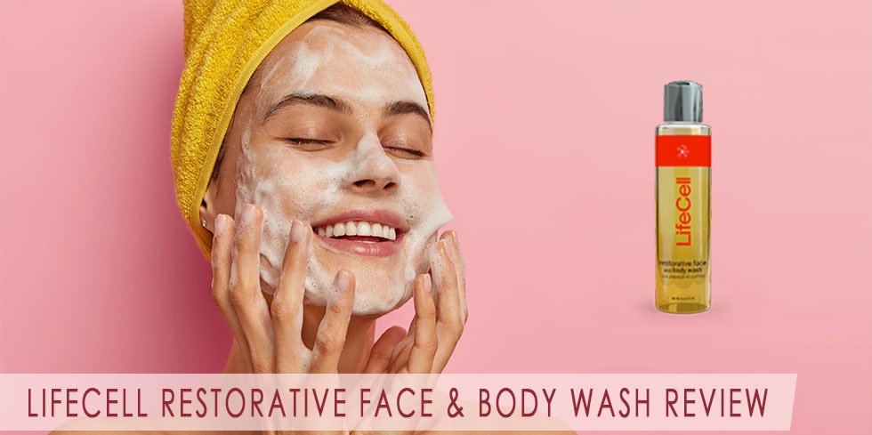 a woman washing her face with a restorative face and body wash