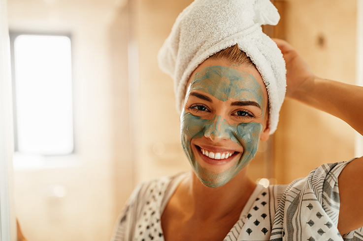 Woman rejuvenating her acne prone skin
