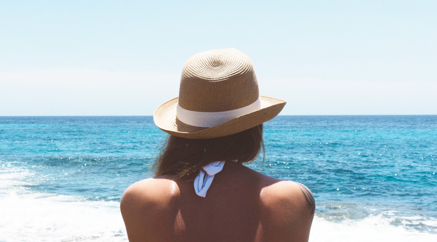 Woman wearing a hat on a beach
